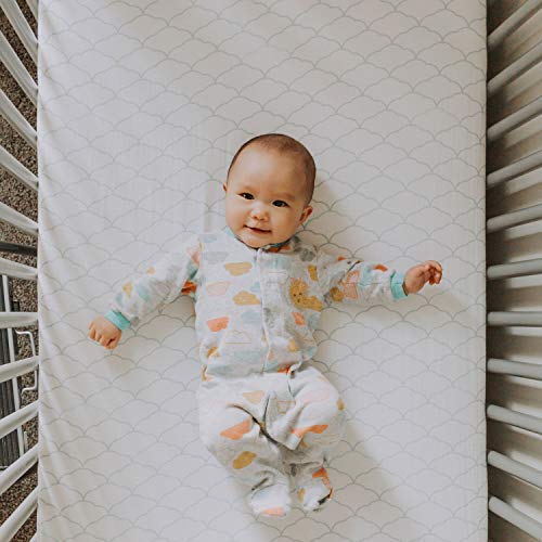 Newton Baby fitted crib sheet showing snug fit on standard mattress