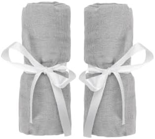 Newton Baby fitted sheet for travel crib showing soft muslin and breathable comfort.