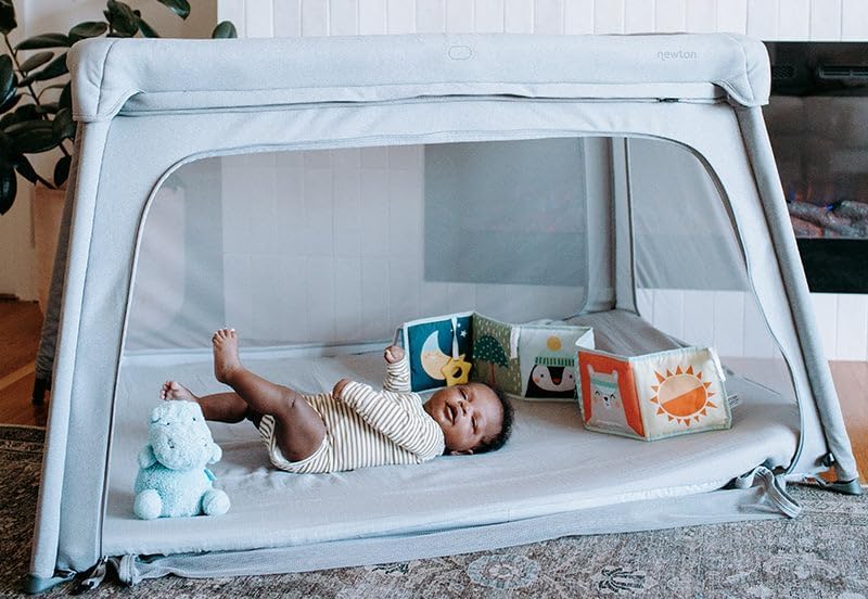 Newton Baby grey sheet emphasizes ultra-breathable, wash-and-go use.