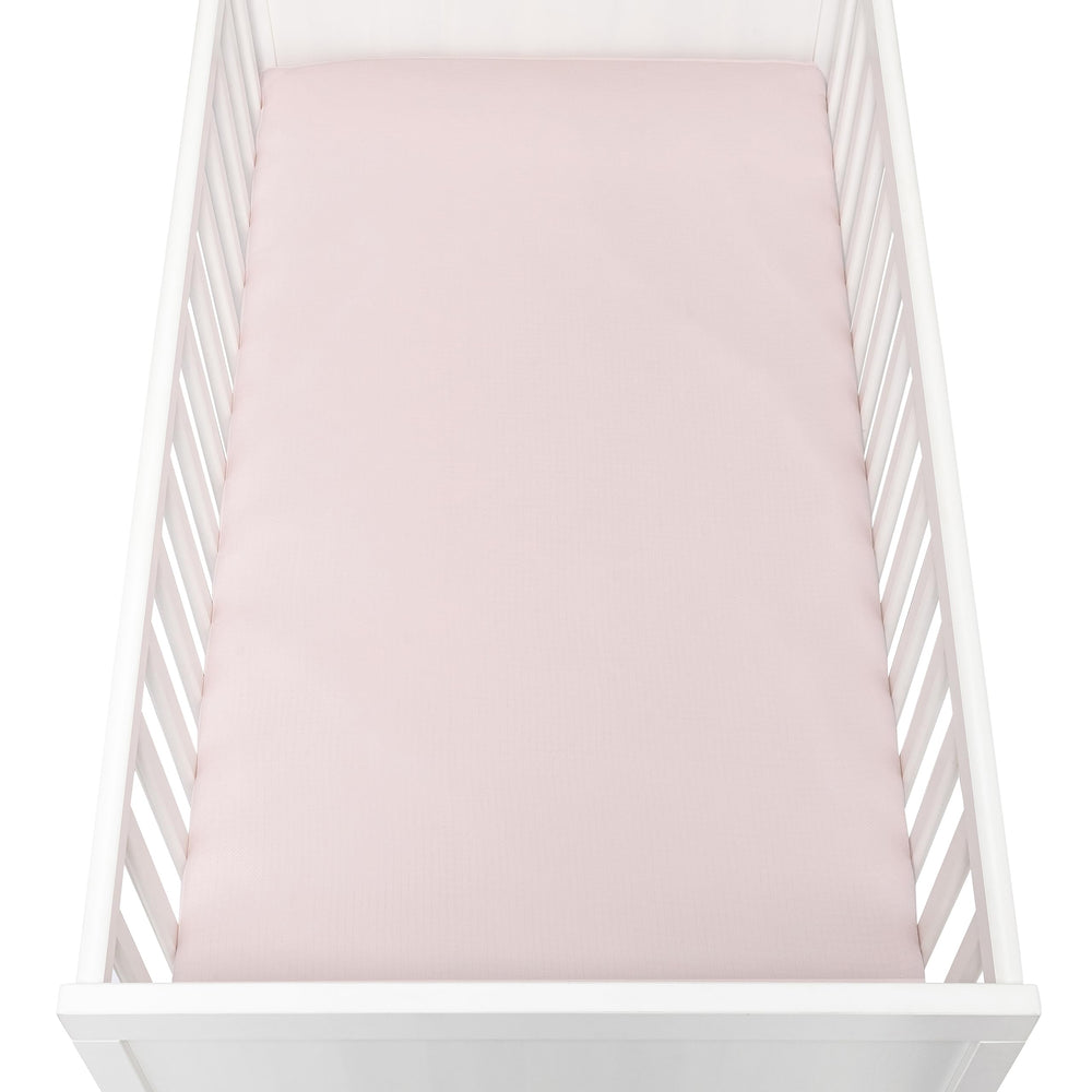 Newton Baby GOTS-certified pink crib sheet, eco-friendly choice.