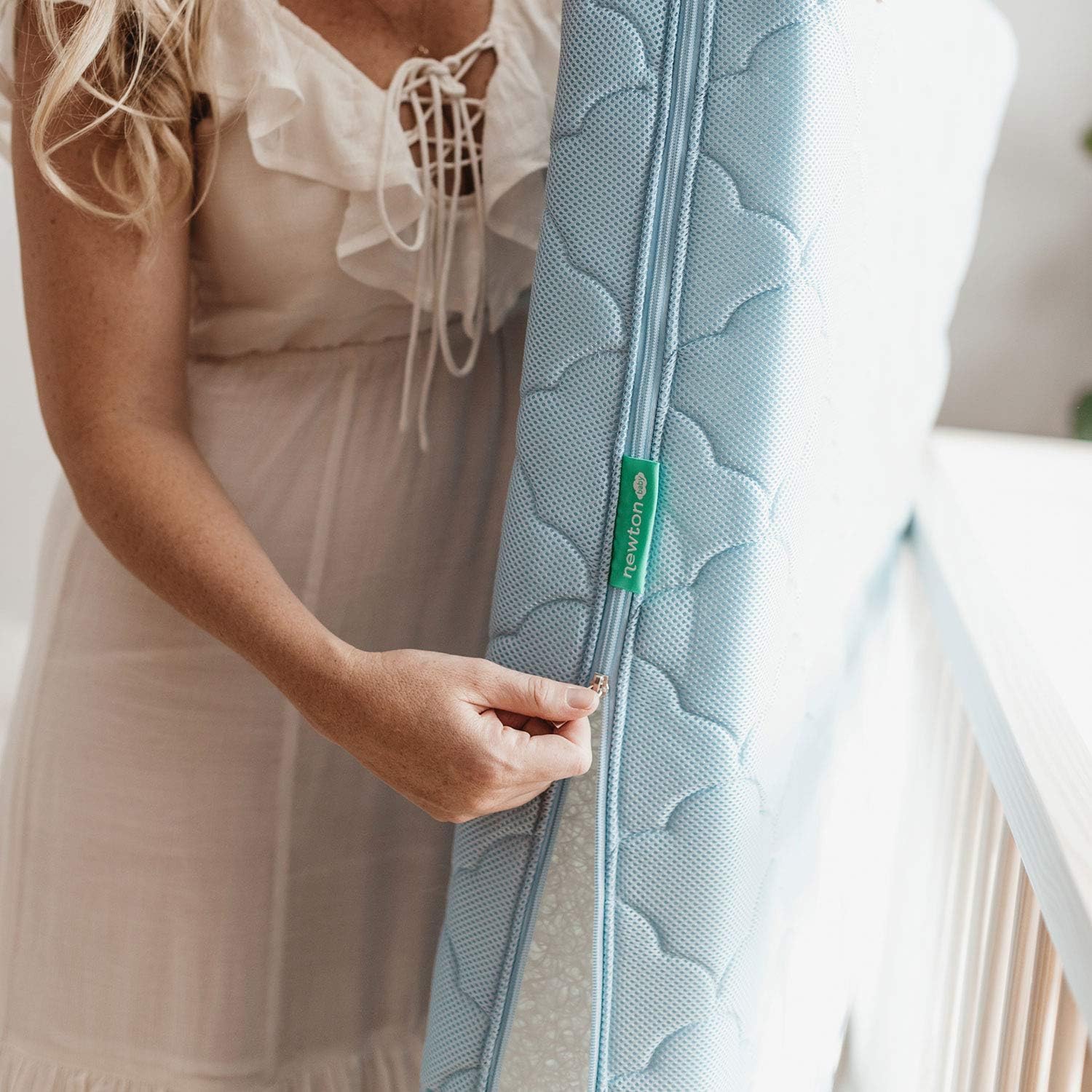 Newton Baby cover in washing machine highlights easy care and durability