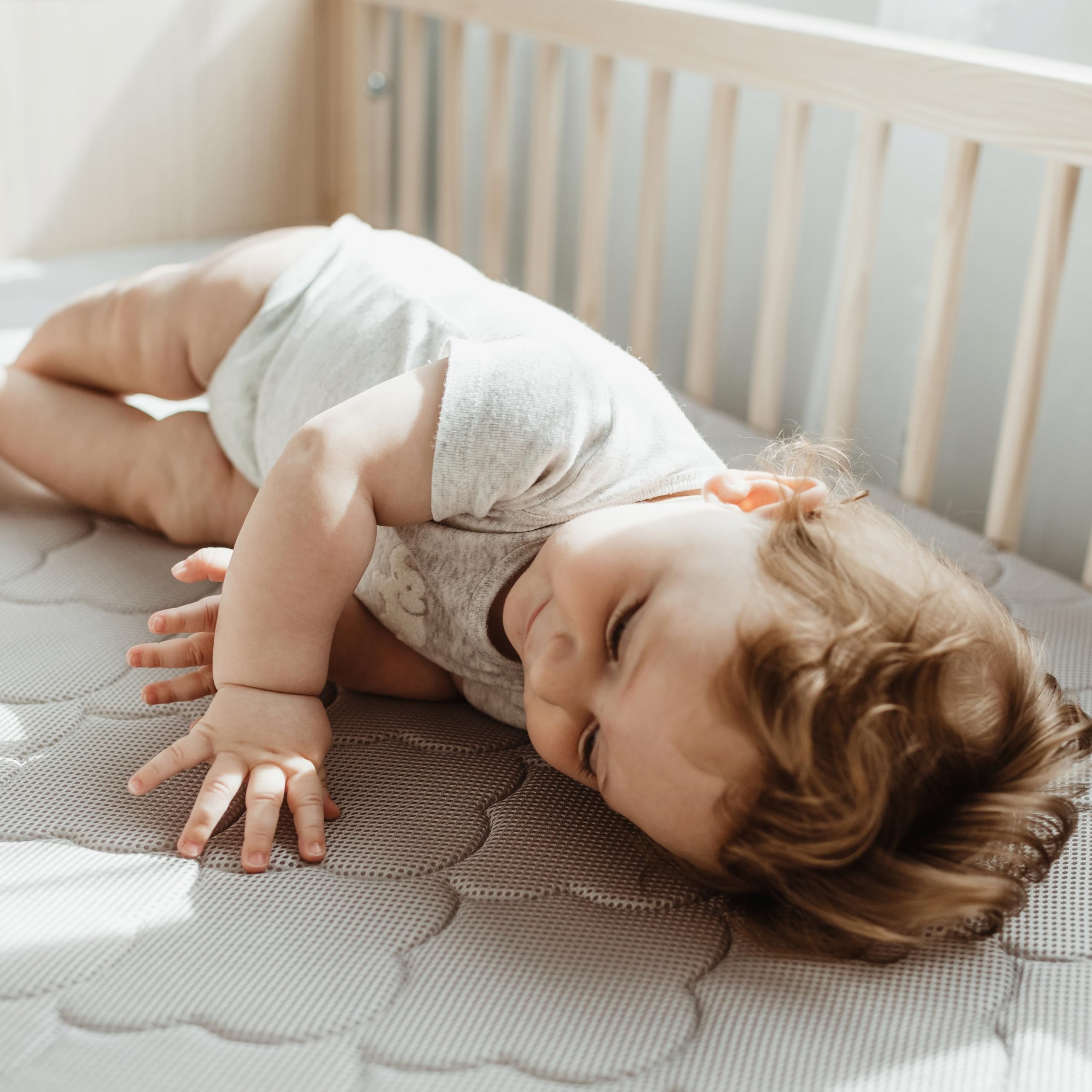 Non-toxic Newton Baby cover supports safe materials for baby sleep