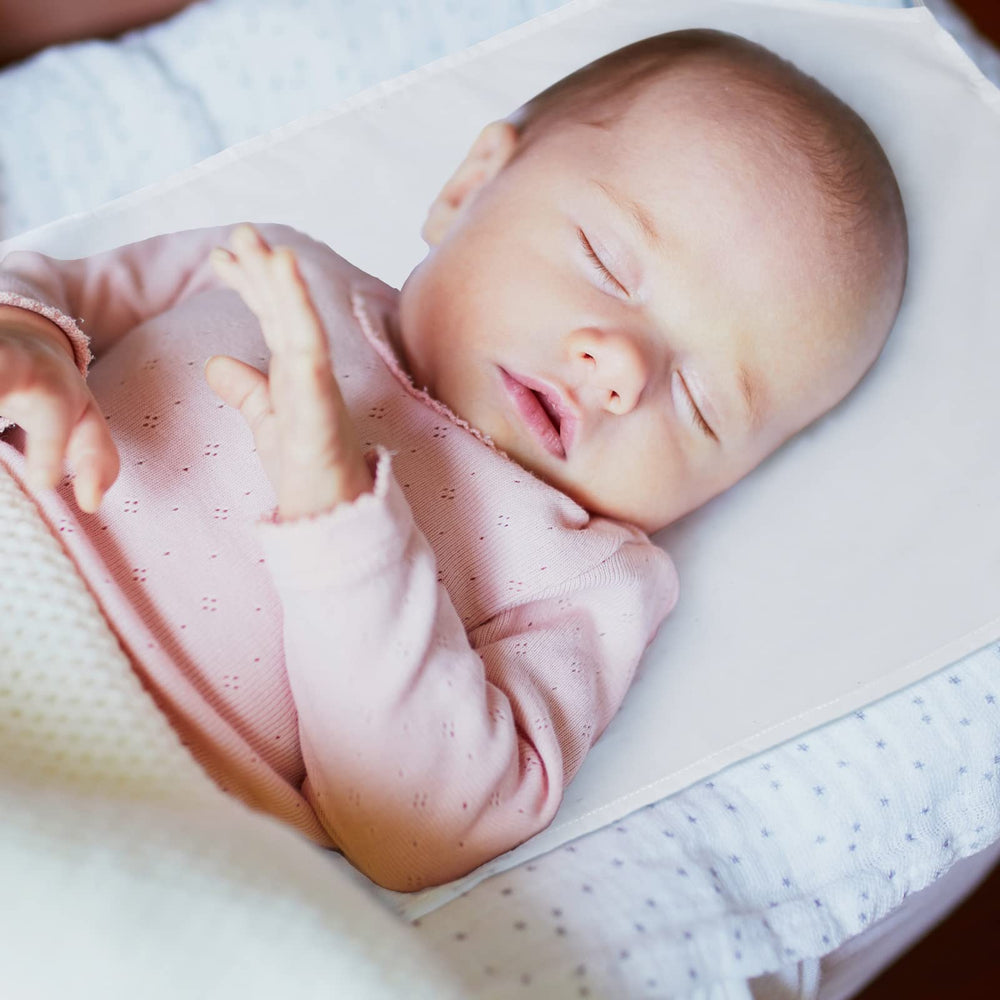Newwiee stackable cot sheets with cutout corners preserving cot holes.
