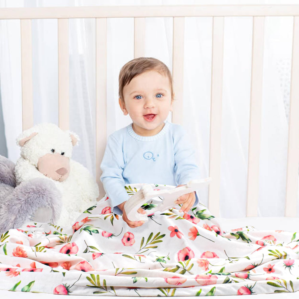 Nialnant floral baby blanket back texture highlights dot pattern for gentle tactile interest.