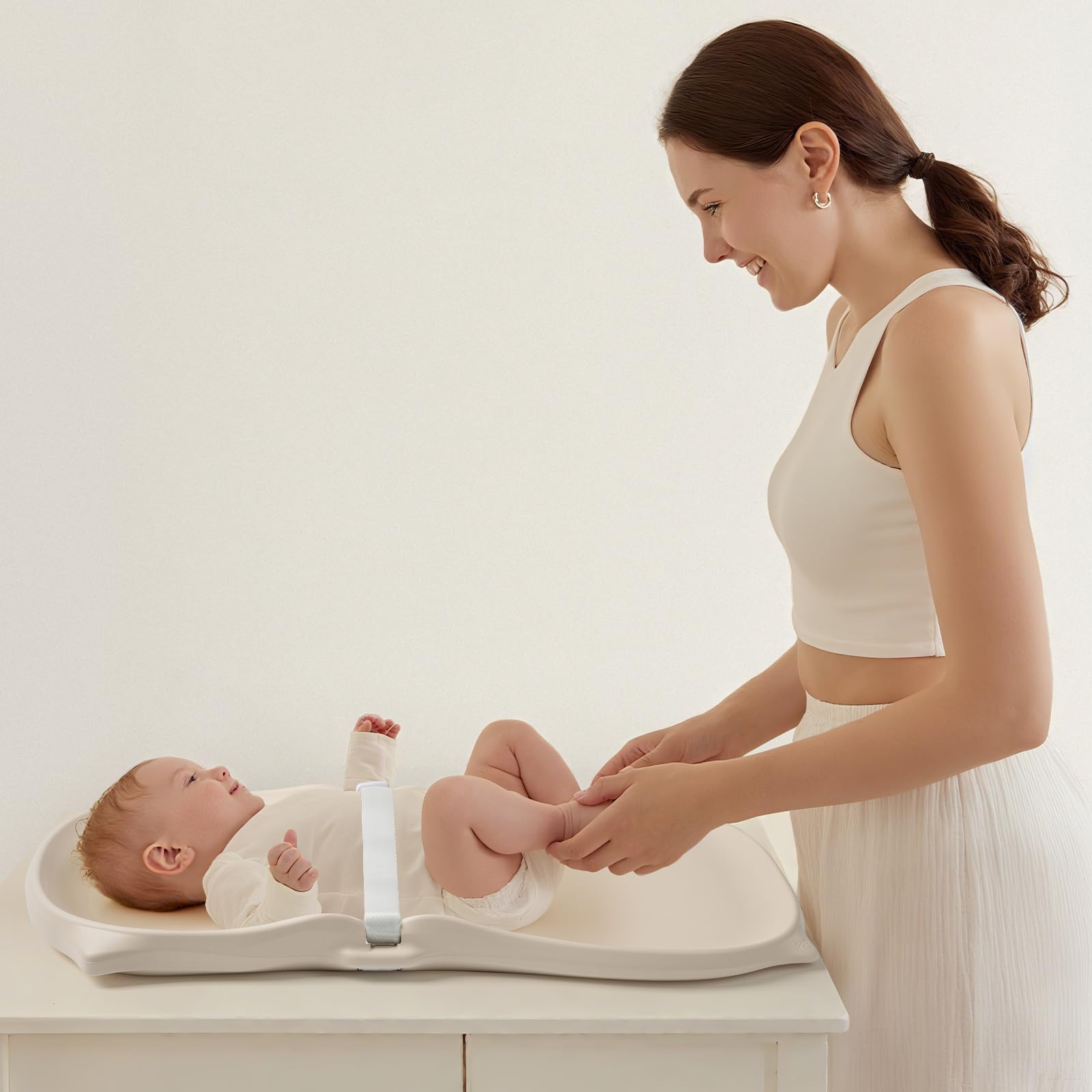 NICEMER changing pad on a dresser or changing table for versatile use.