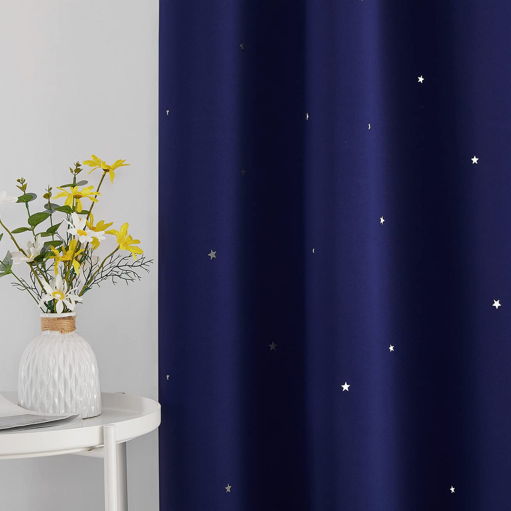 NICETOWN navy-blue blackout curtain with grommets showcasing easy installation and smooth sliding.