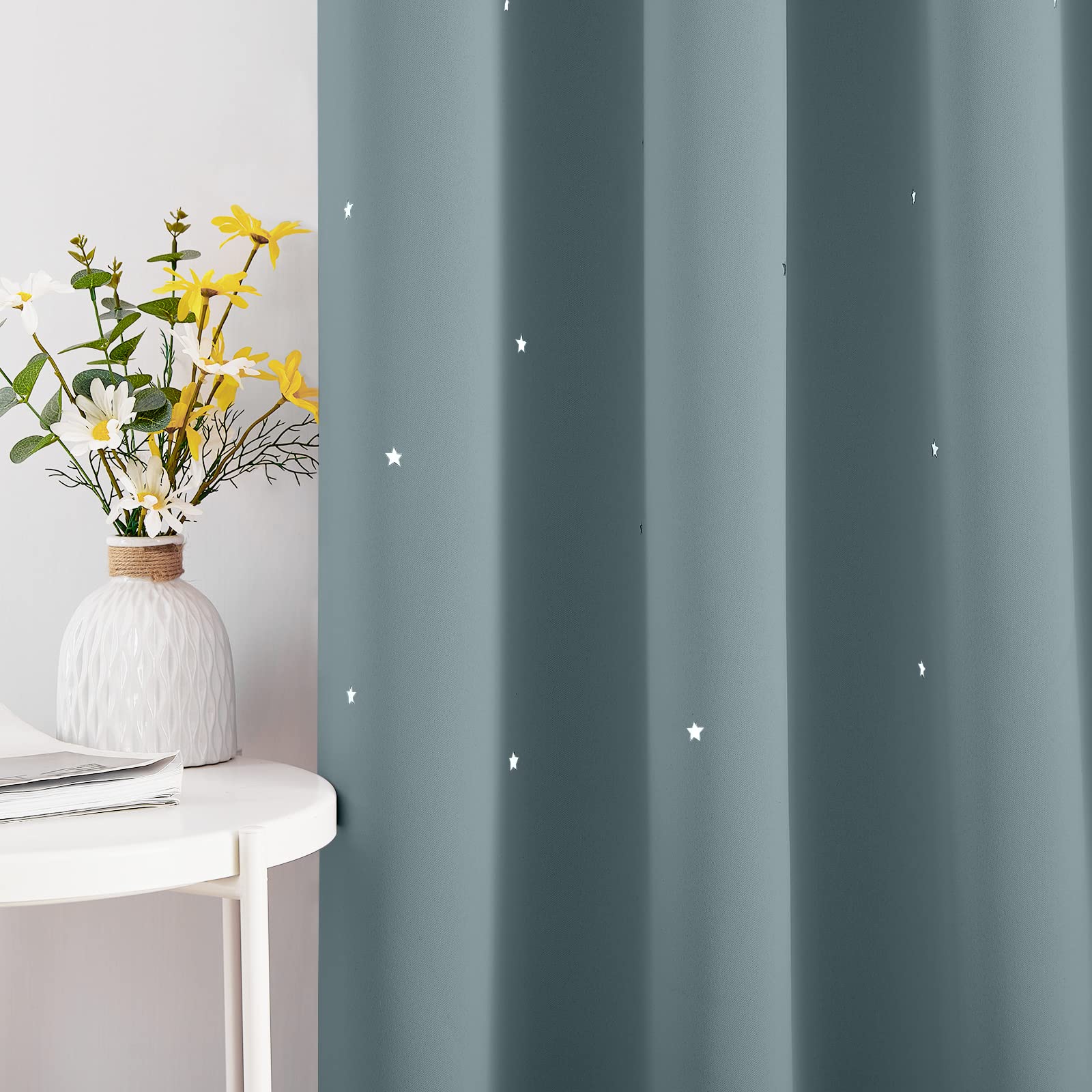 NICETOWN nursery blackout curtains twinkle stars as light shifts, adding a dreamy mood.