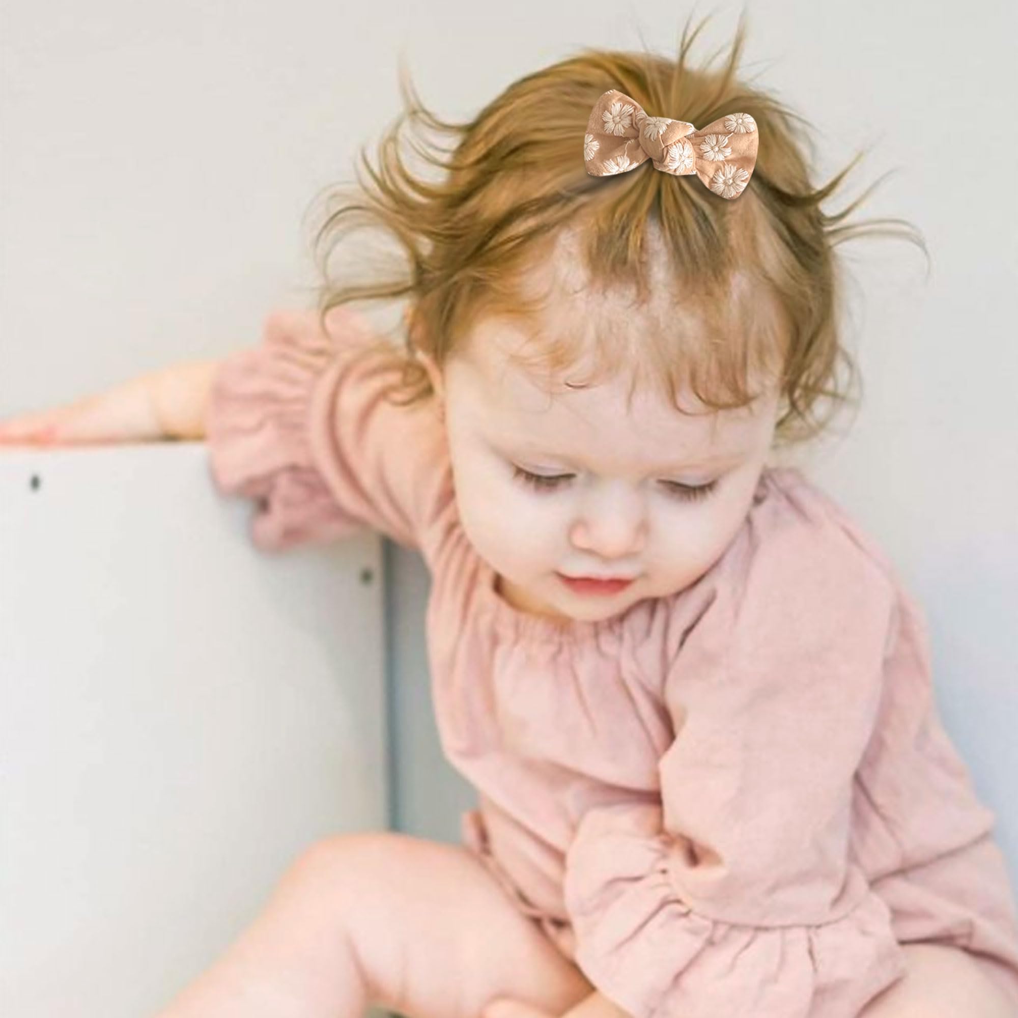 Niceye baby hair clips bun styling closeup focuses on secure placement and tidy hair.