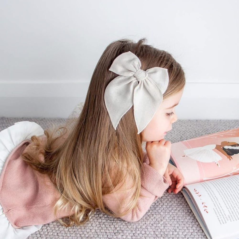 Niceye Fable bows birthday-back-to-school shot shows versatile use for parties and school.