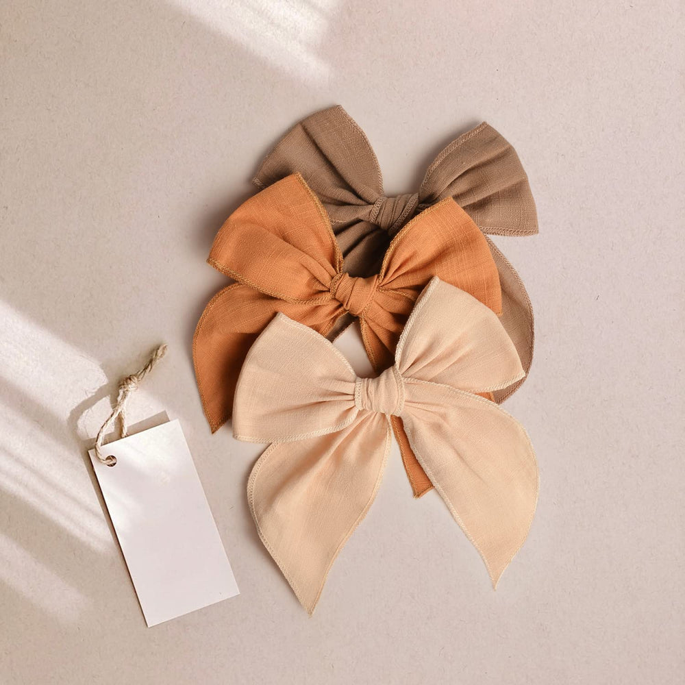 Niceye Fable bows braid-clip closeup illustrates versatile styling for braids and buns.