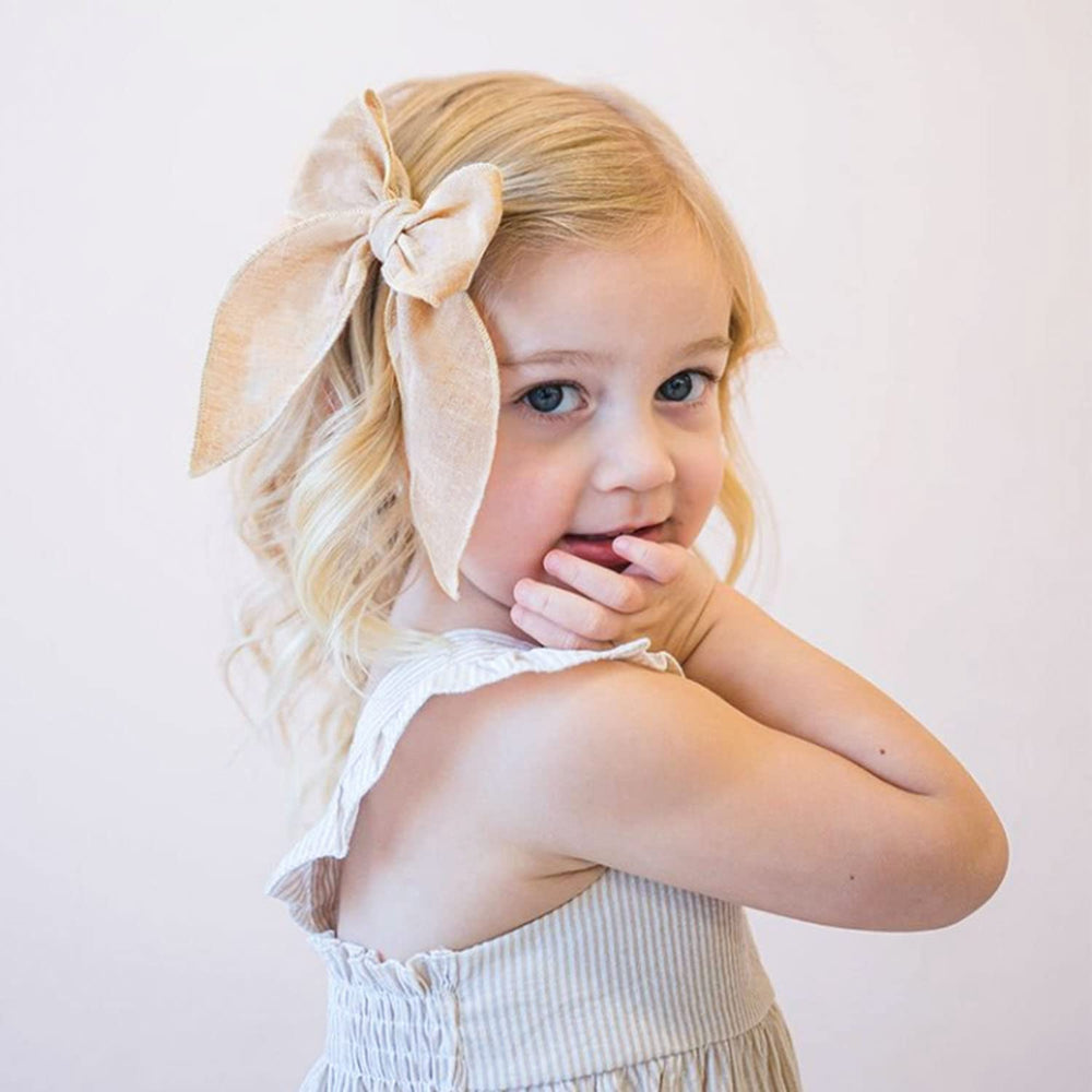 Niceye Fable bows fabric-closeup shows soft cotton-linen fabric ideal for gentle hair.