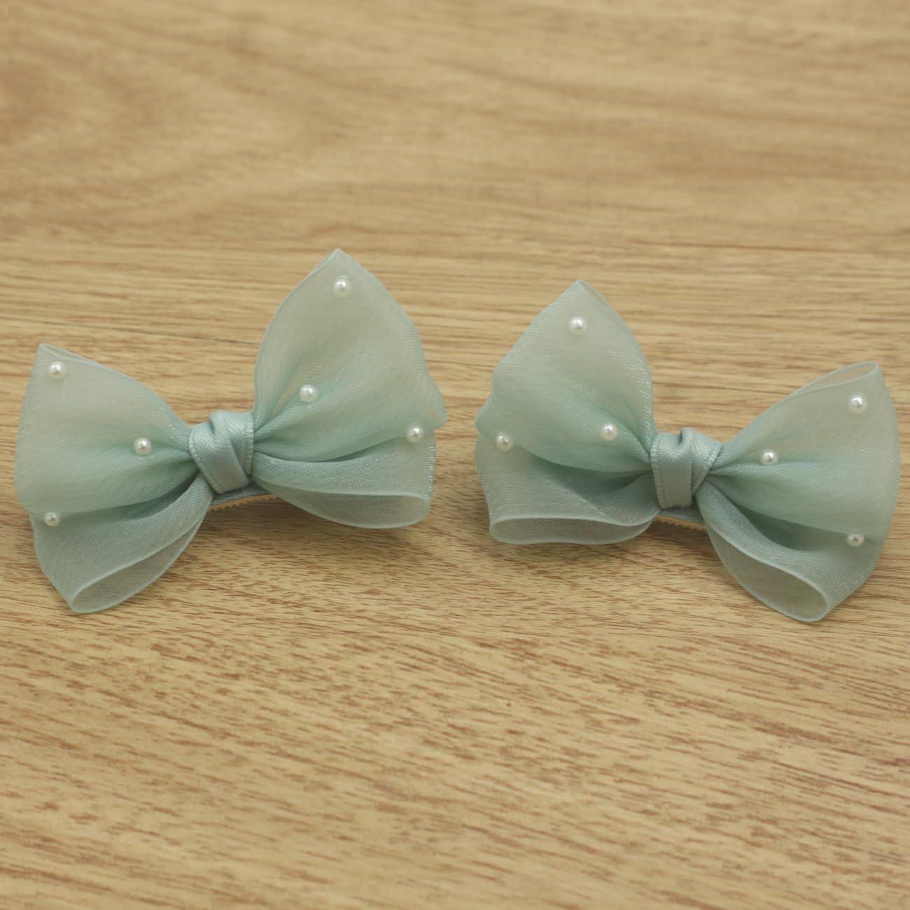 Nihao Baby Pearl Light Green Bow hair clip back view emphasizes durable clip mechanism