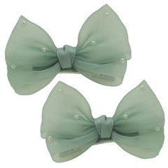 Nihao Baby Pearl Light Green Bow hair clip closeup highlighting glossy pearl accents for chic everyday hairstyles
