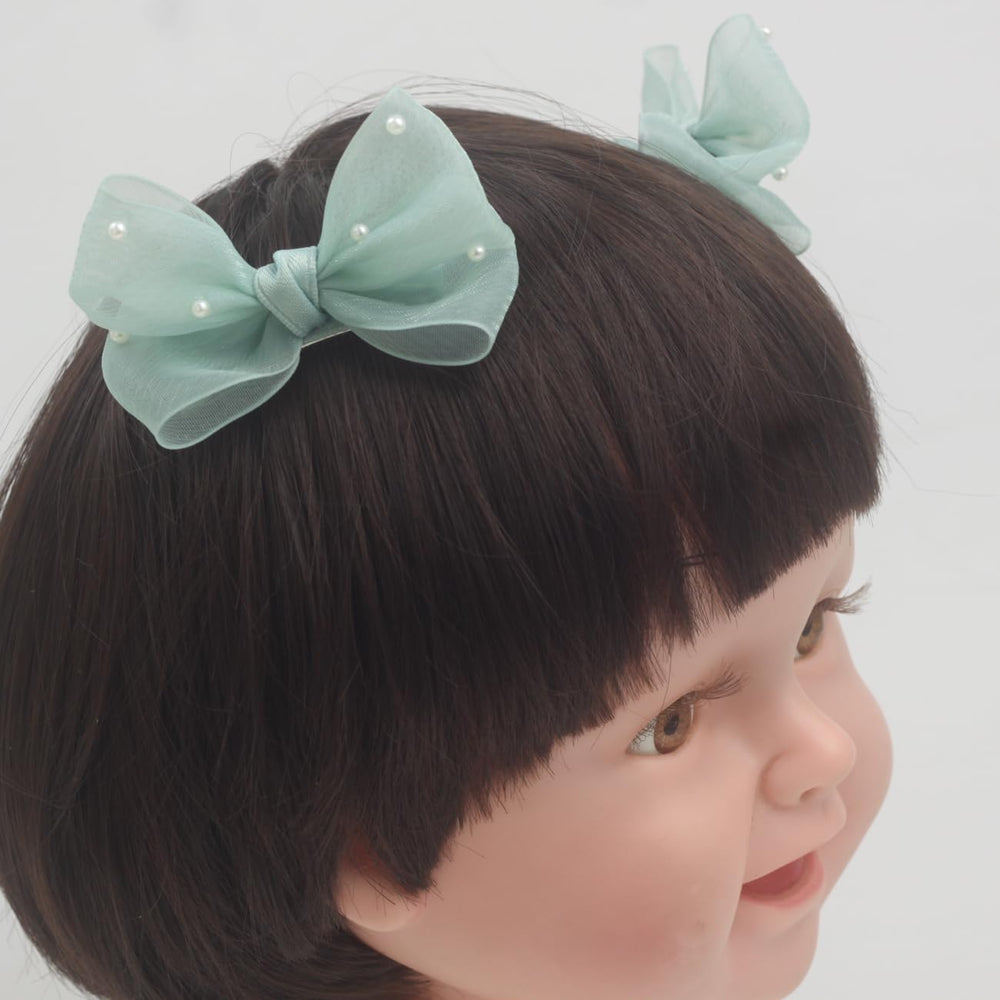 Nihao Baby Pearl Light Green Bow hair clip detail shot highlights pearl accents and pastel tone