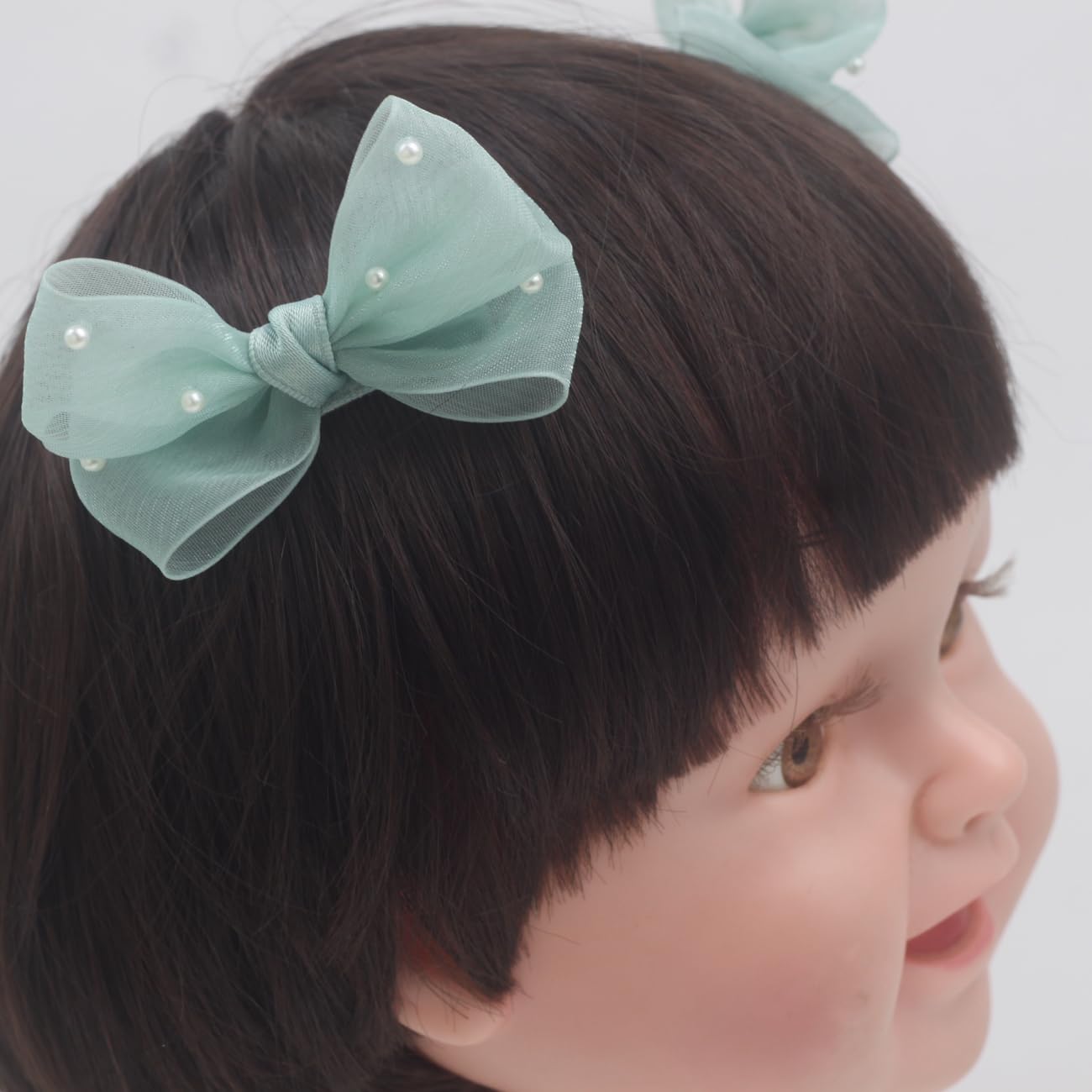 Nihao Baby Pearl Light Green Bow hair clip multi-angle gallery illustrates varied styling options