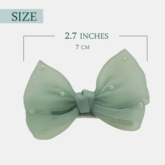 Nihao Baby Pearl Light Green Bow hair clip worn on a child demonstrates secure, comfortable grip