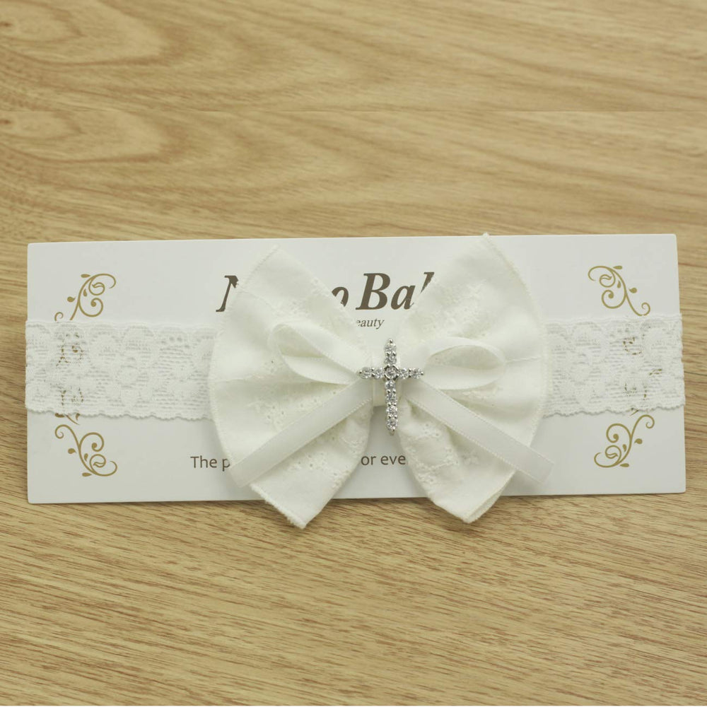 Nihao Baby white headband pairs with satin bows for timeless christening ensembles.