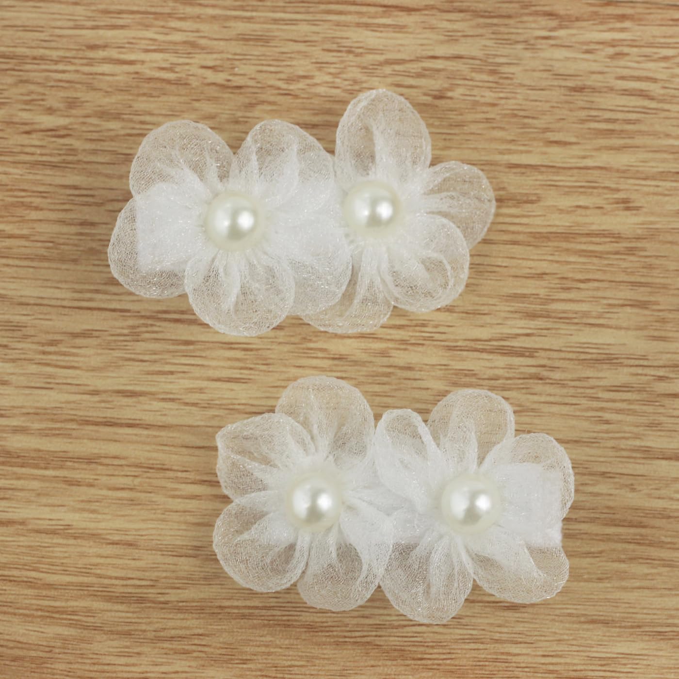 Nihao Baby white flower hair clip on toddler hair showing secure grip