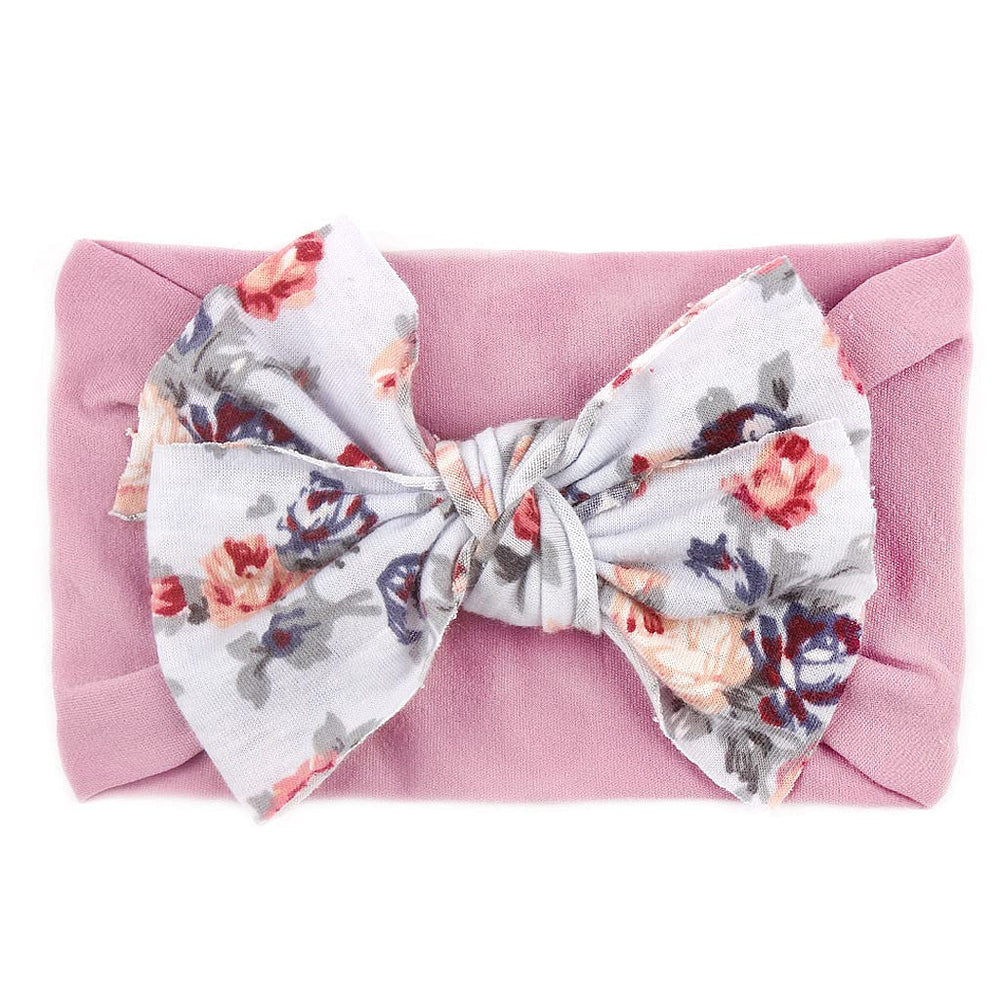 Nishine baby headbands used as photo props to capture adorable moments.