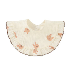 Nishine bibs on infant showing soft cotton against skin