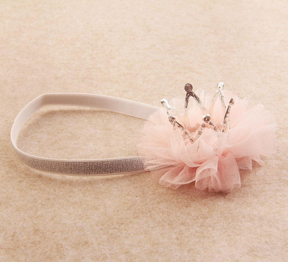 Nishine silvery crown headband on a baby girl, showcasing everyday elegance.