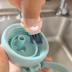 NiuXTool U-shaped silicone rim brush reaches bottle rims.
