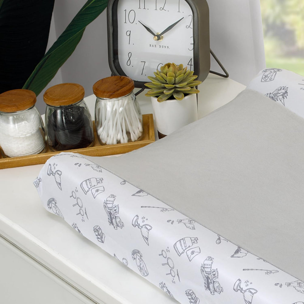 NoJo changing pad cover features wizarding world icons on grey sides for gentle vibes