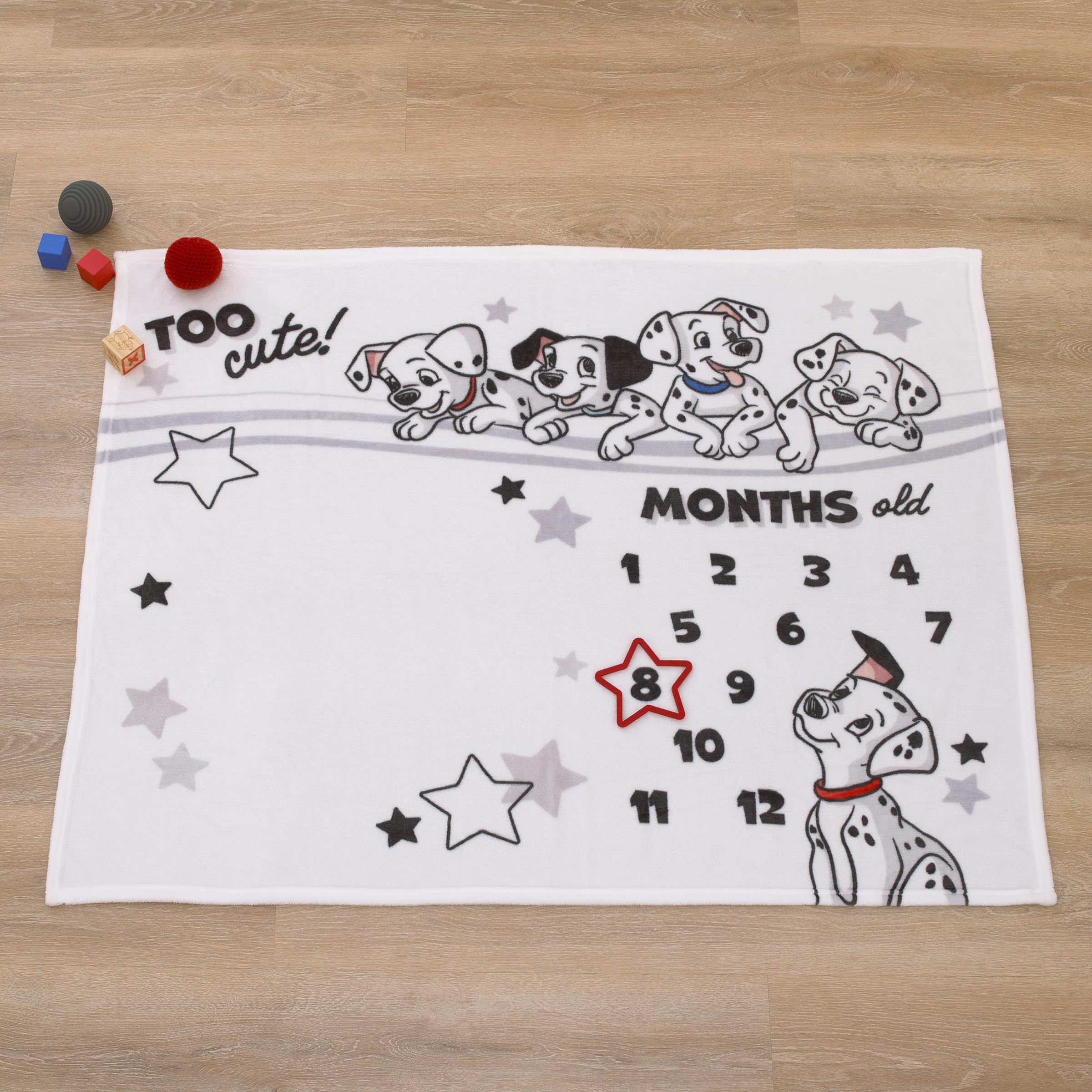 NoJo Disney 101 Dalmatians blanket red accent adds cheerful contrast to photos.