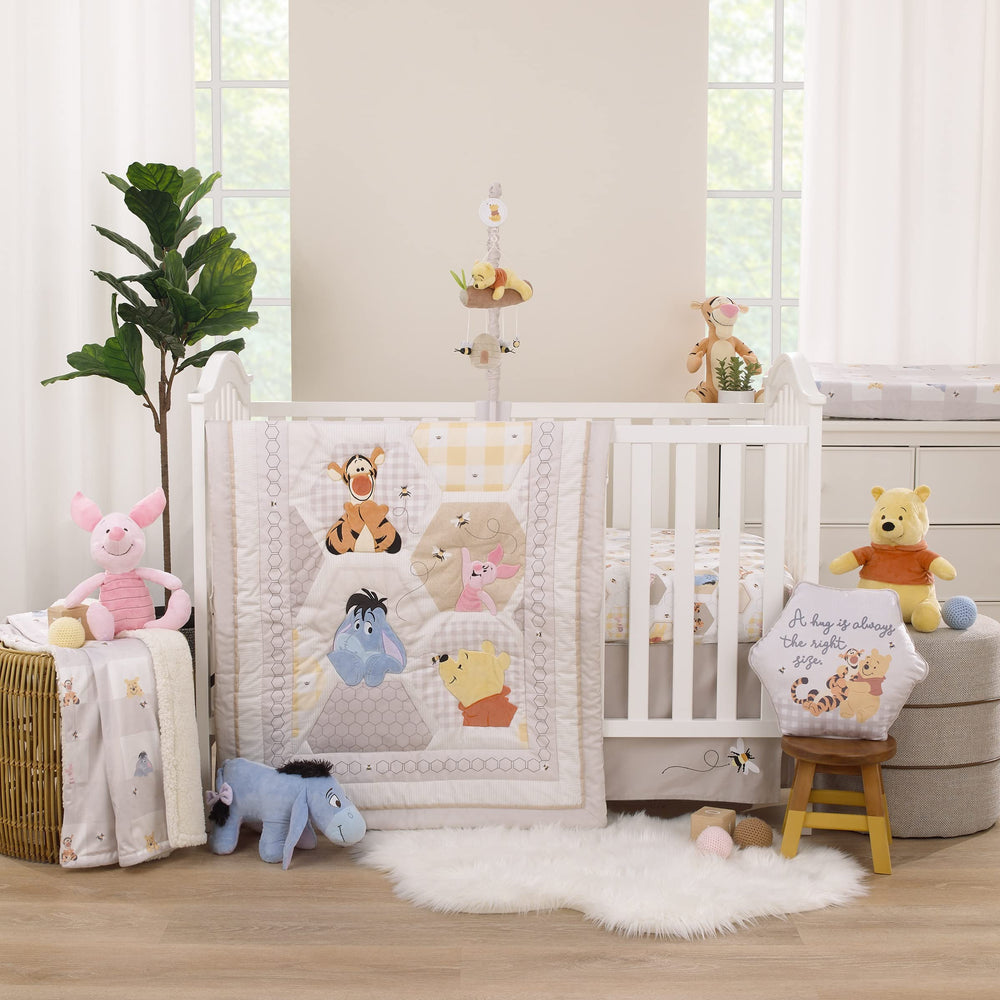 NoJo Disney Pooh honeycombs grey border crib sheet pairs with coordinated bedding