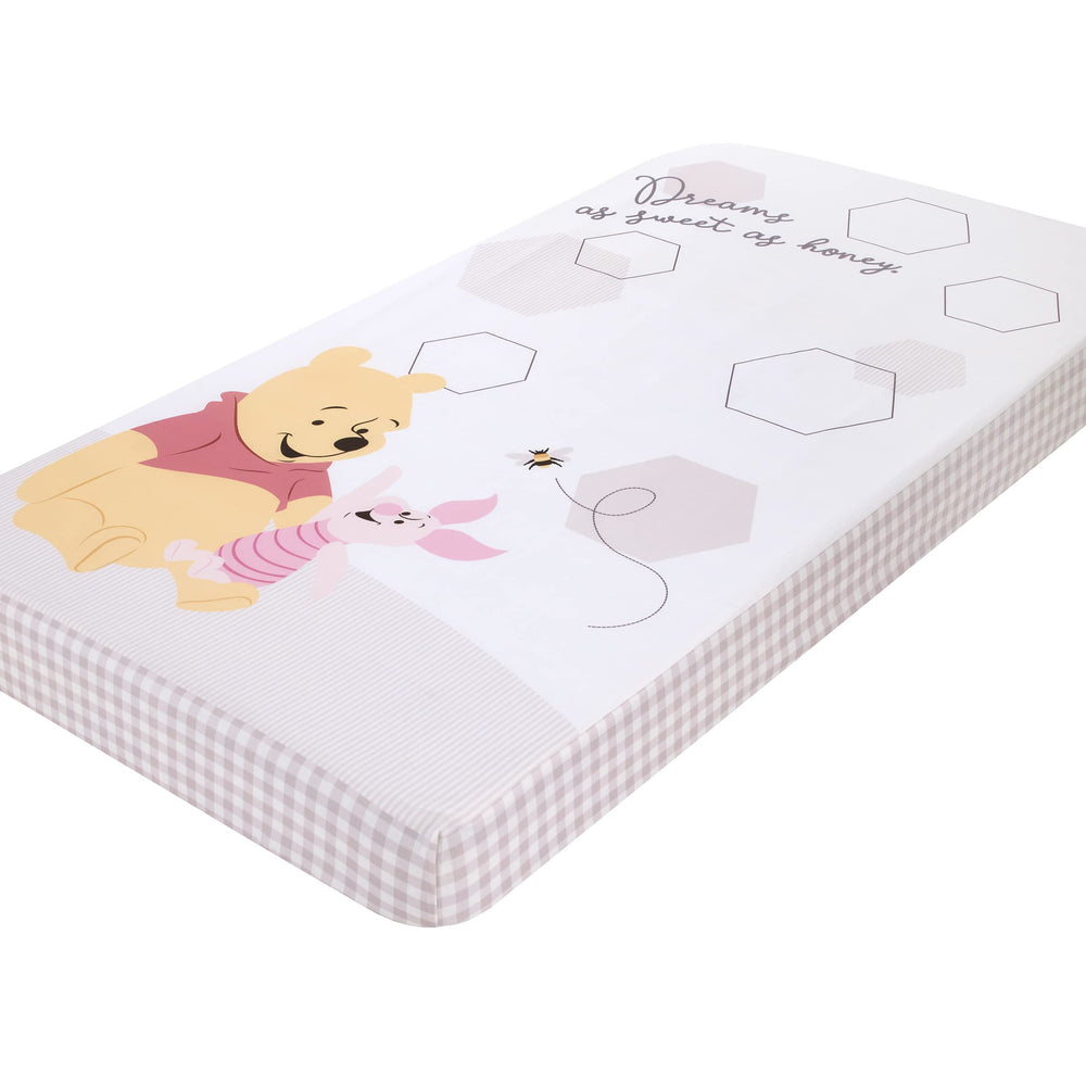 NoJo Winnie the Pooh Hugs Honeycombs crib sheet closeup showing soft cotton finish for restful sleep