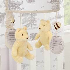 NoJo Pooh Hunny Fun mobile hanging figures to support infant visual tracking.
