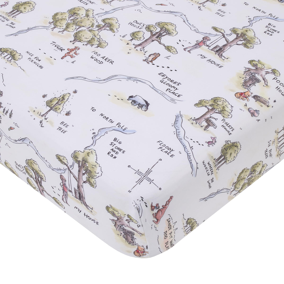 NoJo Disney Winnie the Pooh map crib sheet close-up shows 100 Acre Wood design for cozy nights