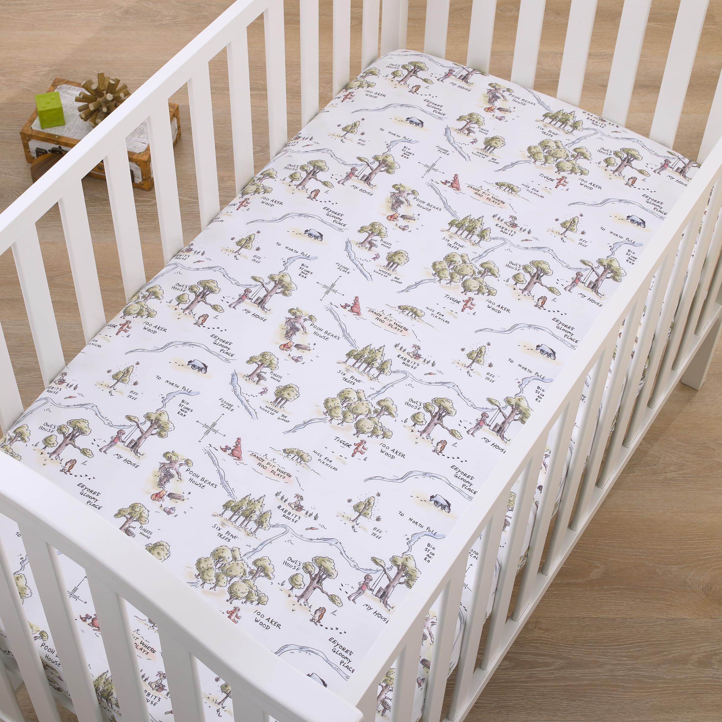 NoJo Pooh map crib sheet on toddler bed highlights versatile, soft fabric for growing use