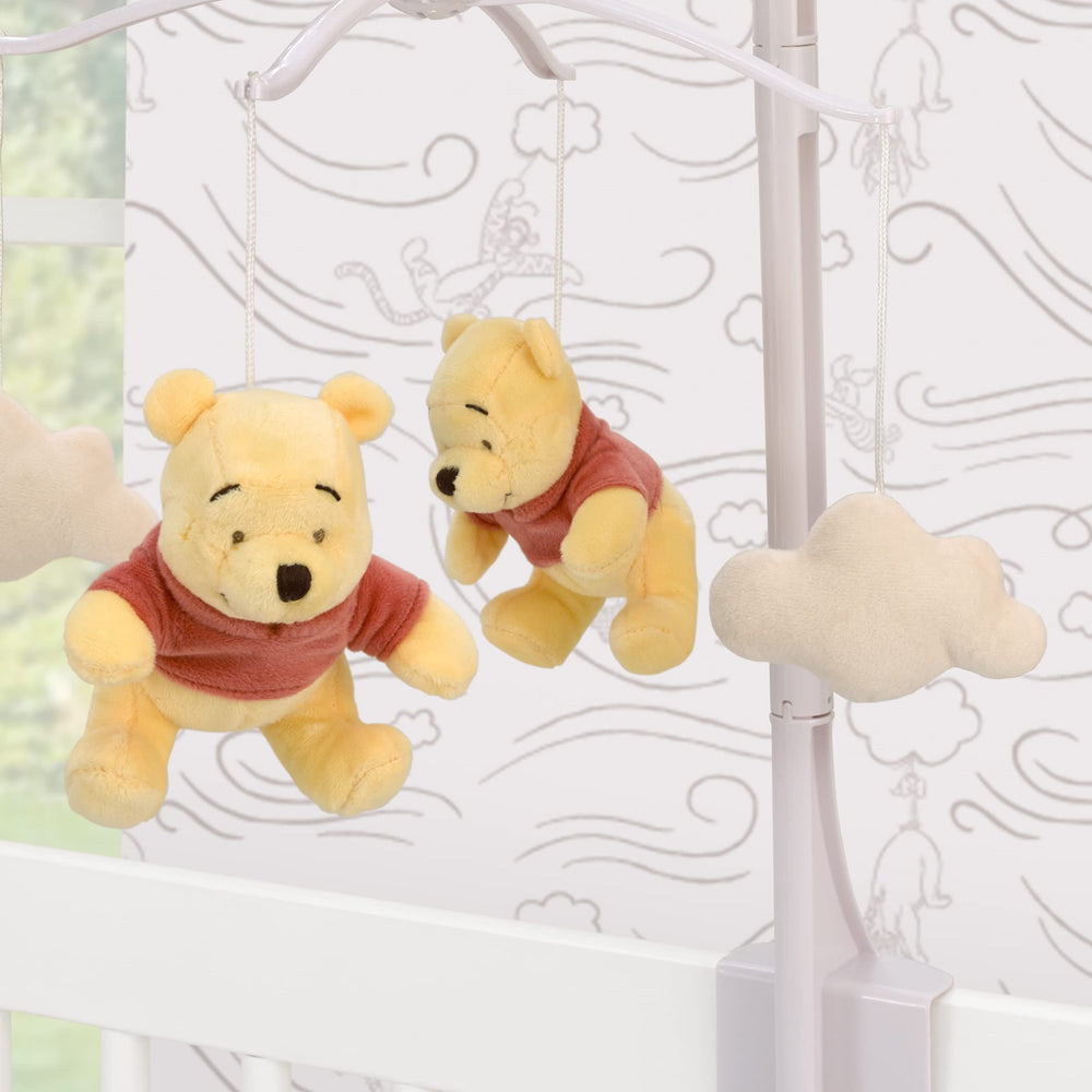 NoJo Winnie the Pooh Blustery Day mobile plays Brahms lullaby during crib time.