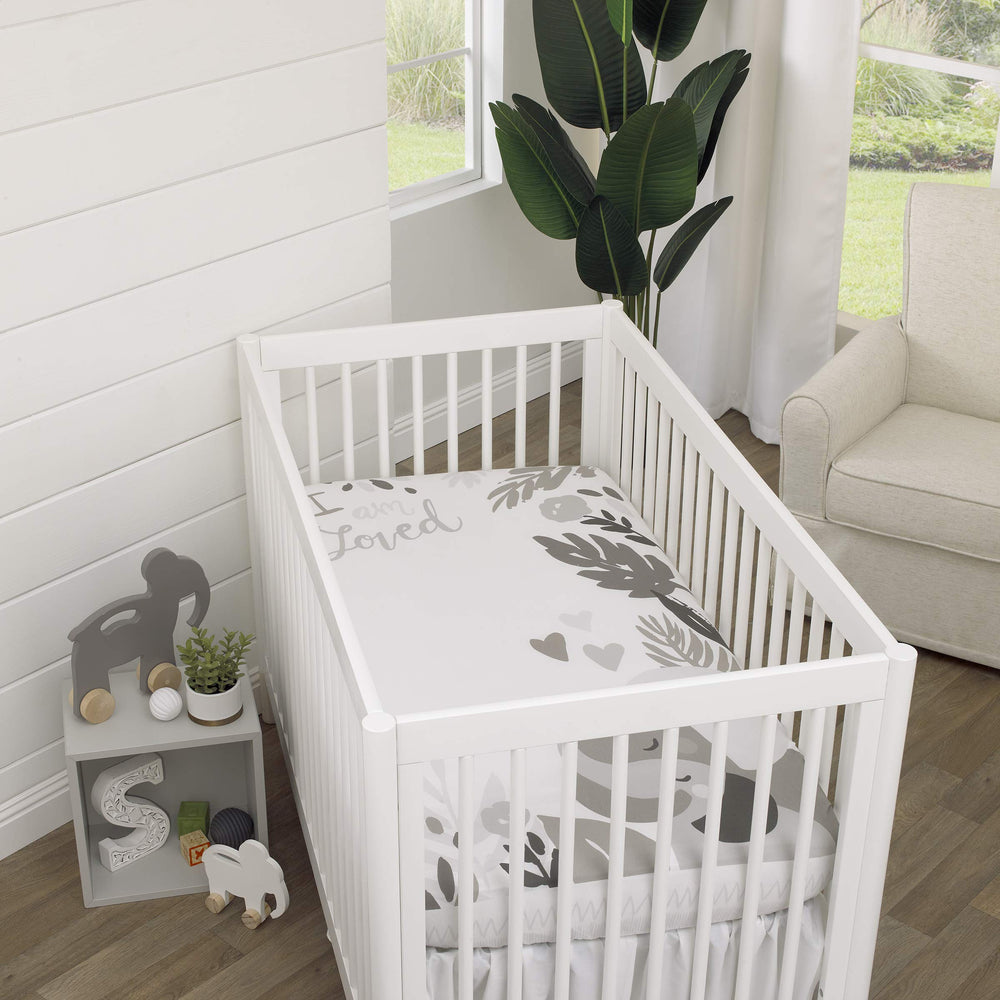 NoJo Elephant Hugs crib sheet in grey and white creates a playful, photo-ready backdrop.