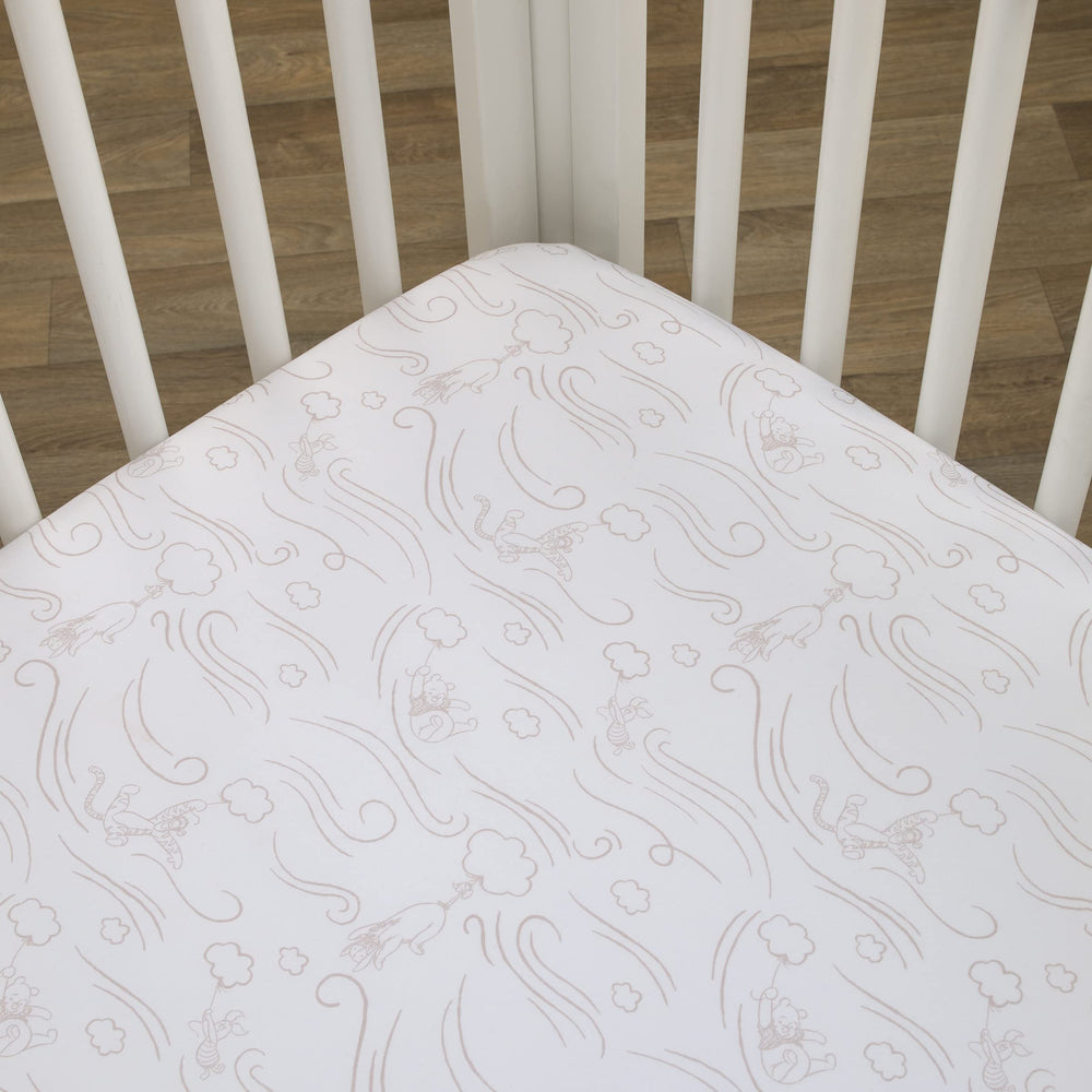NoJo Pooh cloud pattern crib sheet closeup in grey and white tones