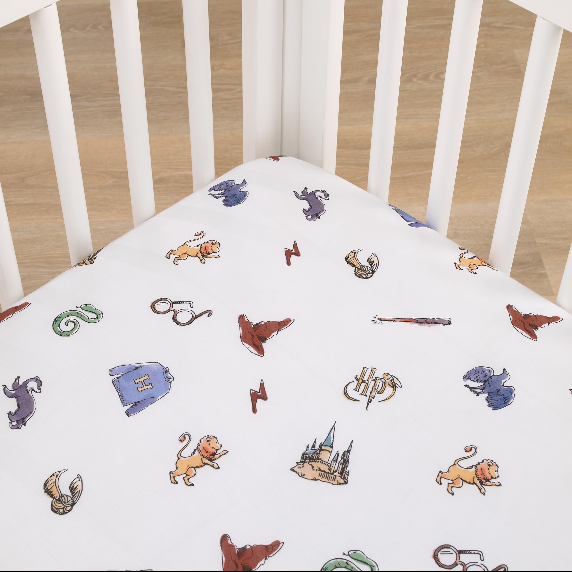 NoJo Harry Potter Welcome Little Wizard crib sheet icon-pattern showing magical symbols for bedtime imagination.