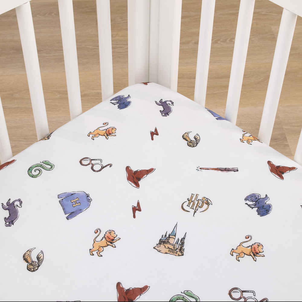 NoJo Harry Potter Welcome Little Wizard crib sheet icon-pattern showing magical symbols for bedtime imagination.