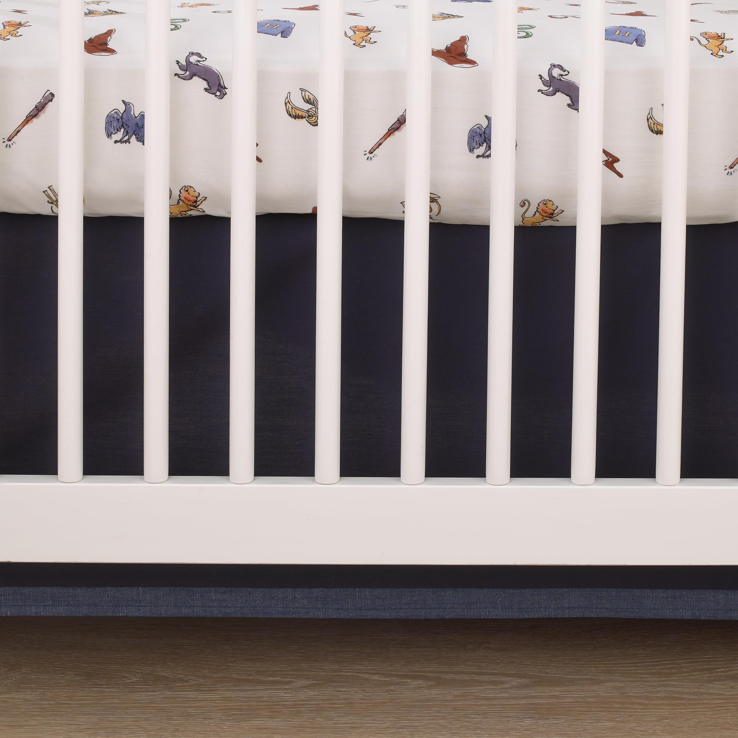 NoJo Harry Potter Welcome Little Wizard crib sheet on standard mattress demonstrates easy-care machine washability.