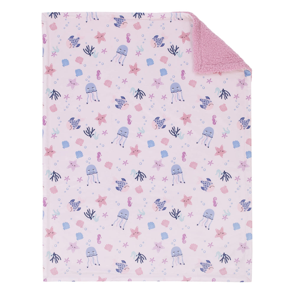 NoJo Mermaid Lagoon reverse-sherpa texture adds warmth for nap time.