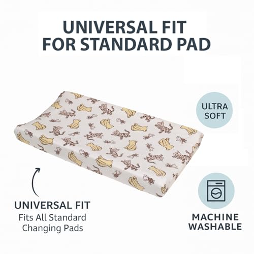 NoJo white-ground Pooh print creates serene backdrop for calm diaper changes.