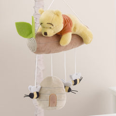 NoJo Pooh bear close-up on a branch encourages gentle focus during lullaby