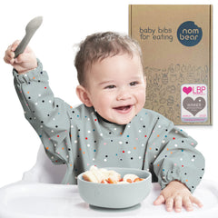 Nombear waterproof smock bib for eating keeps outfits clean during baby-led weaning.