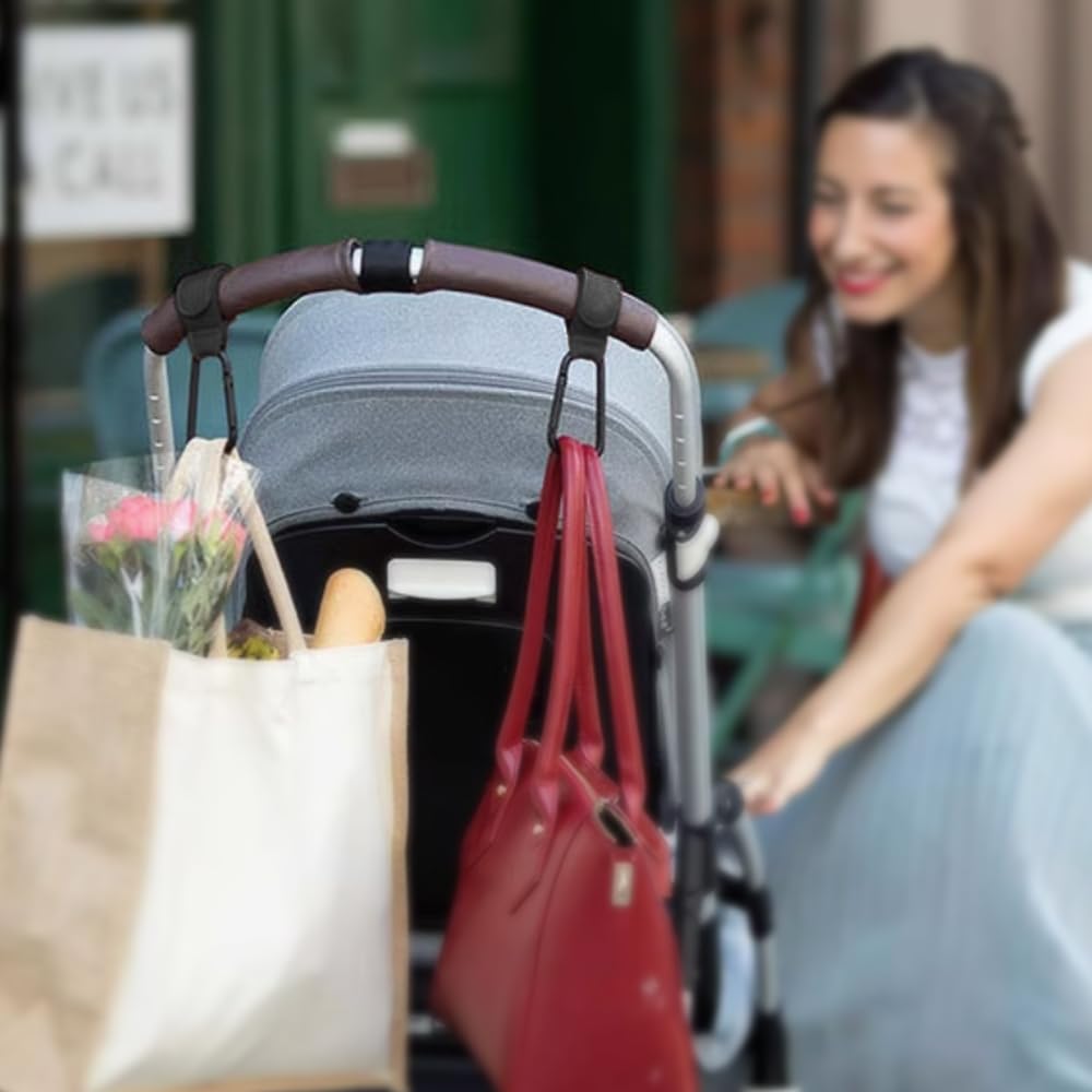 Noneea stroller hook holding multiple bags during shopping for hands-free convenience.