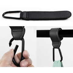 Noneea stroller hook attached to a bag for easy travel organization.