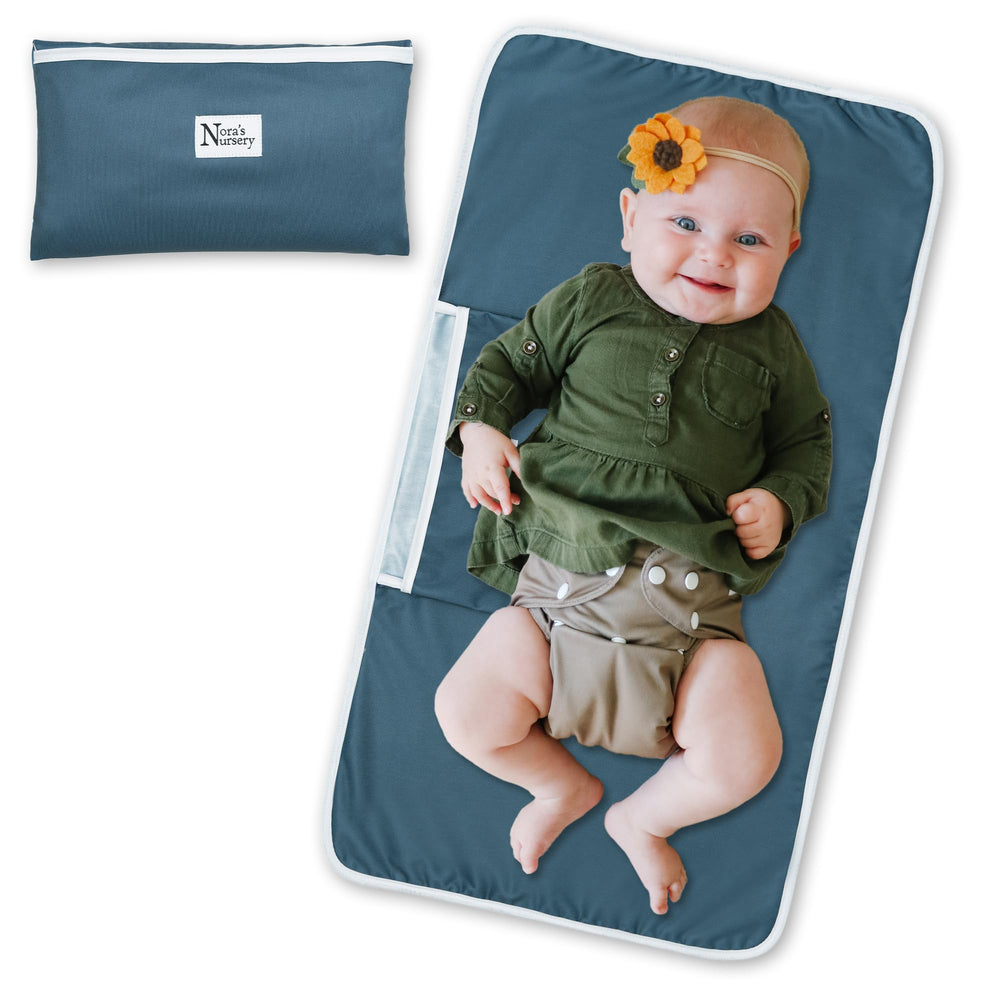 Nora's Nursery Sea changing pad opened for quick, comfortable diaper changes.