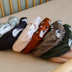 Nora's Nursery AWJ waterproof cover close-up emphasizing leak-proof outer layer for day and night.