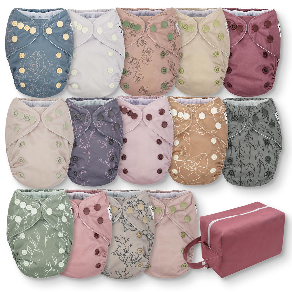Nora's Nursery Blushing Blooms diaper with adjustable snaps for a snug newborn fit.