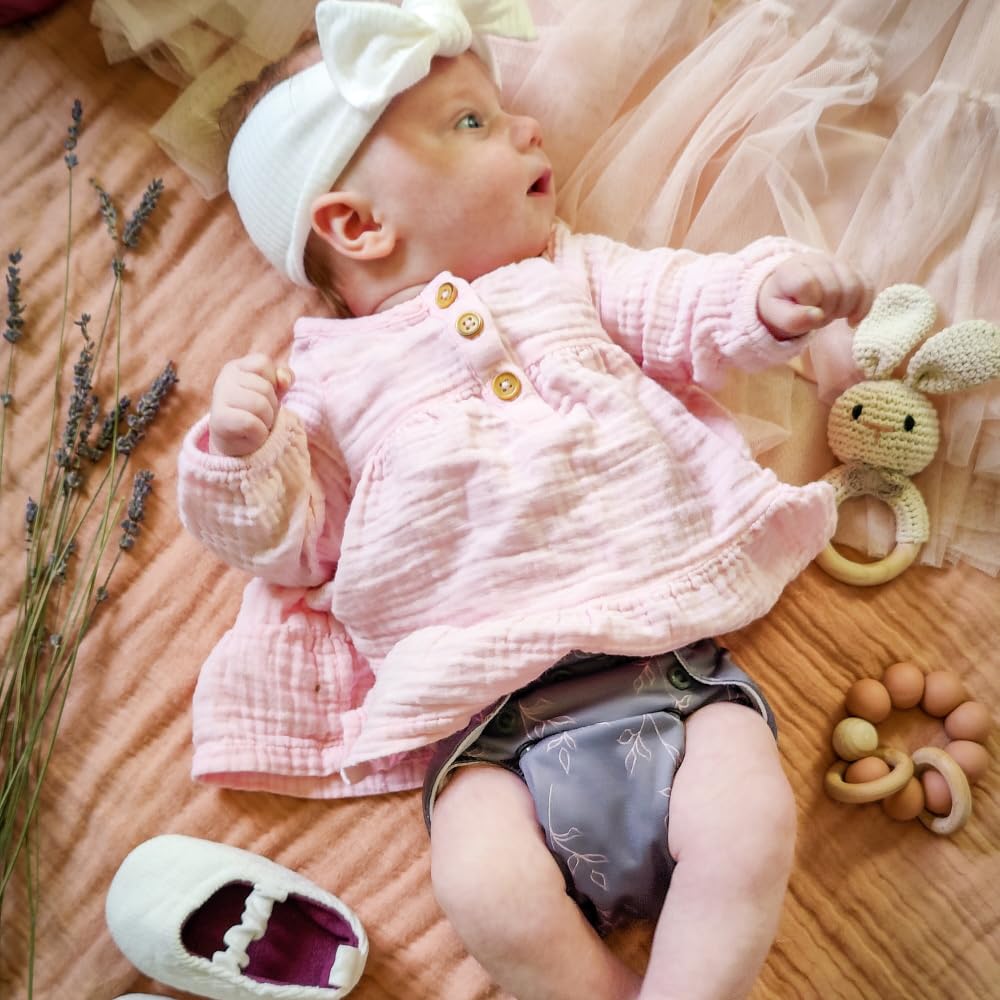 Nora's Nursery diaper pod capacity holding multiple newborn diapers.