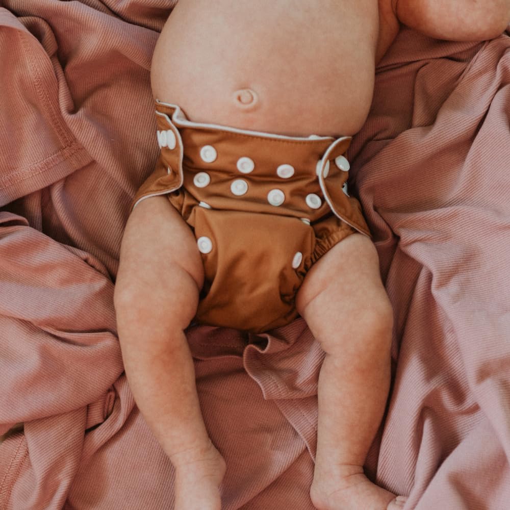 Nora's Nursery diaper pod detachable strap enables easy transport between rooms or outings.